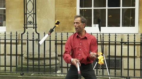 Bath juggler with 3 fire sticks Vídeo Stock 42090460