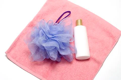 Bath puff liquid soap and towel Stock Photos