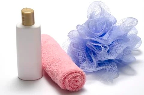 Bath puff liquid soap and towel Stock Photos