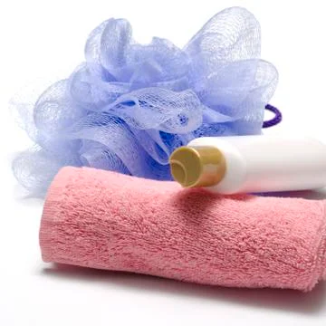 Bath puff liquid soap and towel Stock Photos