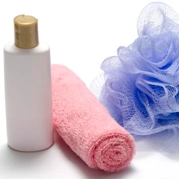 Bath puff liquid soap and towel Stock Photos