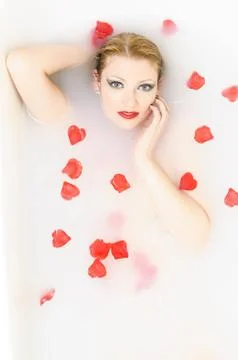 Bath with rose petals Stock Photos