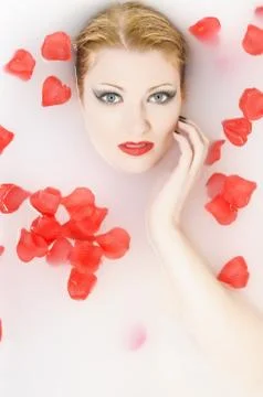 Bath with rose petals Stock Photos