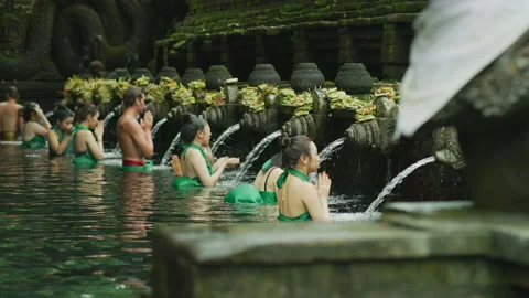 Bath in the sacred spring at Tirta Empul Stock Footage 218339411