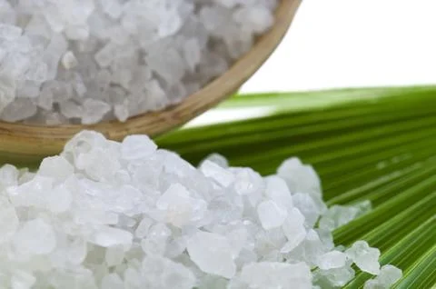 Bath salt and palm leaf Stock Photos
