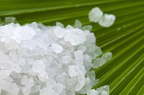 Bath salt and palm leaf Stock Photos