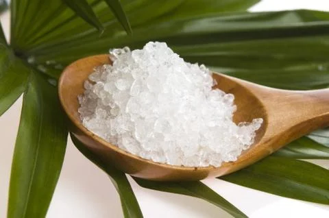 Bath salt and palm leaf Stock Photos