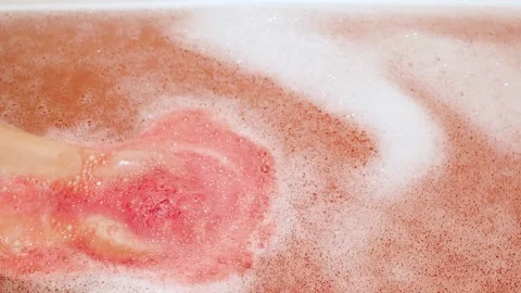 Bath Salt Ball Dissolves In The Hands. Ball Of Salt Dissolves In Water Stock Footage 231302013