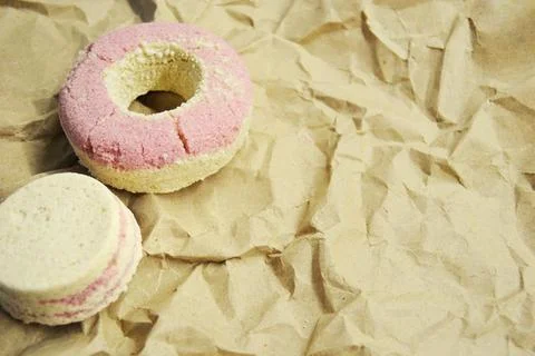 Bath salt in the shape of a donut on brown paper background Stock Photos