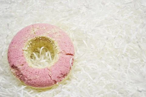 Bath salt in the shape of a donut on white background Stock Photos
