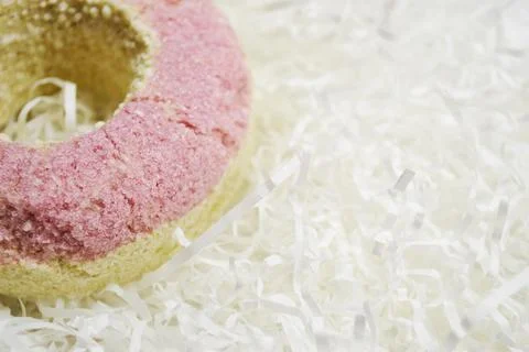 Bath salt in the shape of a donut on white background Stock Photos