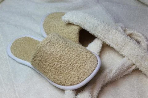 Bath slippers and bathrobe Stock Photos