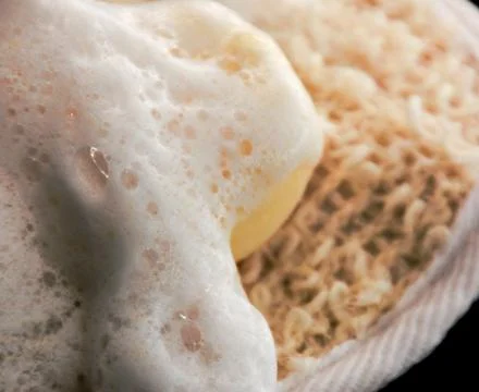 Bath soapy sponge on white background Stock Photos