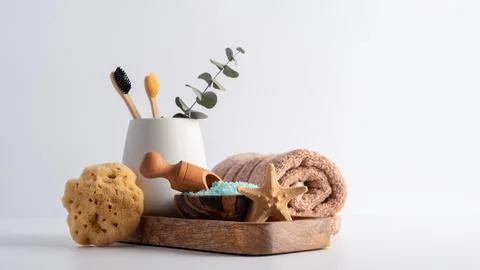 Bath Spa Setting with blue sea salt, natural wild sponge and bamboo toothbrus 库存照片