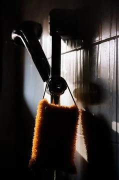 Bath sponge and shower head silhoettes Stock Photos