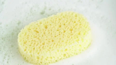 Bath sponge on soap suds. Shower sponge with soap suds. SPA concept. Stock Footage 271232361