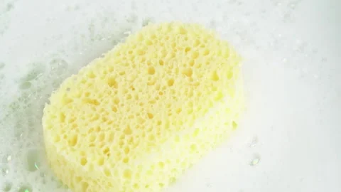 Bath sponge on soap suds. Shower sponge with soap suds. SPA concept. Stock Footage 275143841
