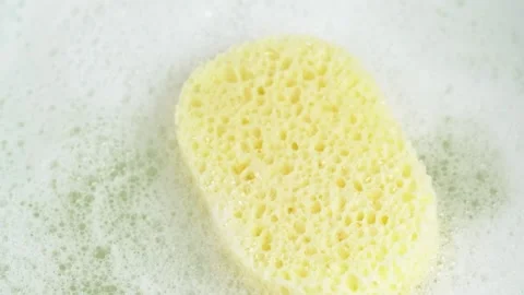 Bath sponge on soap suds. Shower sponge with soap suds. SPA concept. Stock Footage 278147929