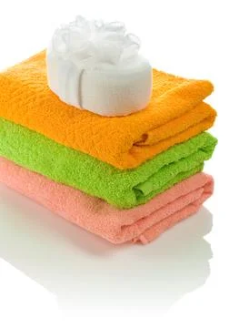 Bath sponge on towels Stock Photos