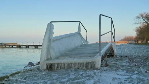 Bath steps covered in ice, Balaton lake in winter Video stock 326321469
