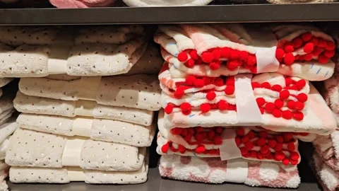 Bath towel stack on shelves in shop. Assortment of blankets and towels. 스톡 동영상 334768070