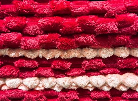 Bath towels of different colors folded in a stack, towels in a closet, fabric Stock-Fotos