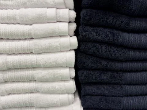 Bath towels of different colors folded in a stack, towels in a closet, fabric Foto stock