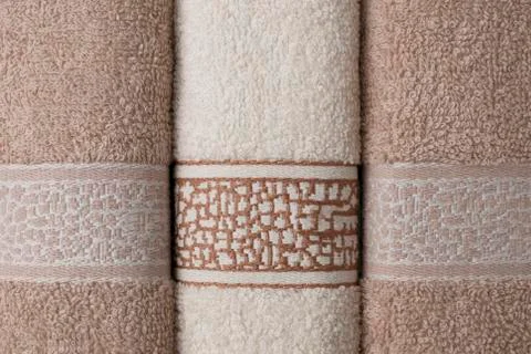 Bath towels lined up on the table Stock Photos