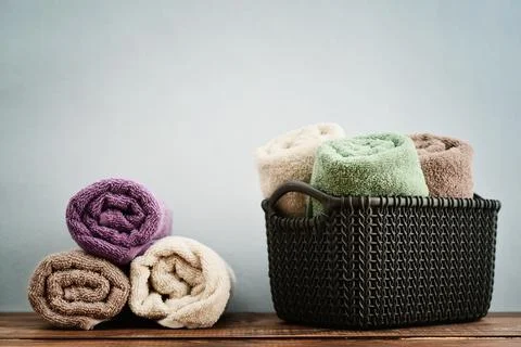 Bath towels  in wicker basket Stock Photos