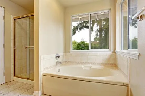 Bath tub with windows Stock Photos