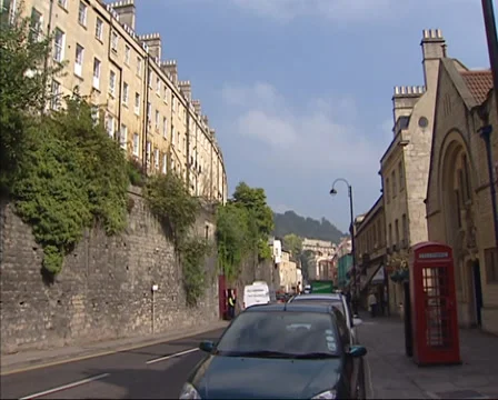 BATH Walcot street scene, phone booth, traffic, city wall with terraced houses Stock Footage 37884086