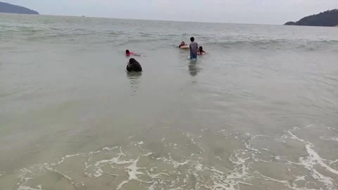 Bathe on the beach Stock Footage 205595766