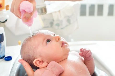 Bathe newborn Stock Photos