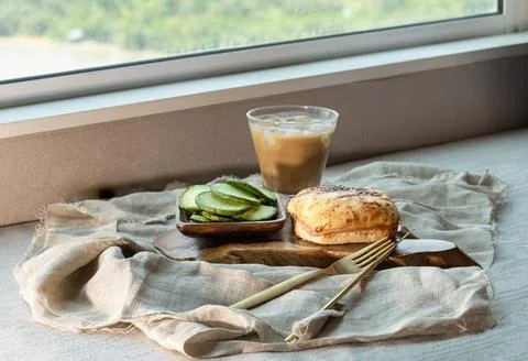 Bathed in the glow of a sun-drenched window, this artisanal breakfast is a .. Stock Photos