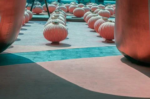 Bathed in a sharp contrast of light and shadow, these ribbed spheres are pr.. Stockfoto's