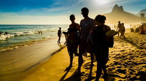 Bathers playing ball at the edge of the beach Stock Footage 35602328