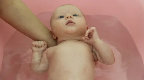 Bathing a baby Stock Footage 32626206