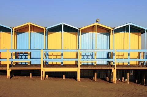 Bathing boxes on the beach Stock Photos
