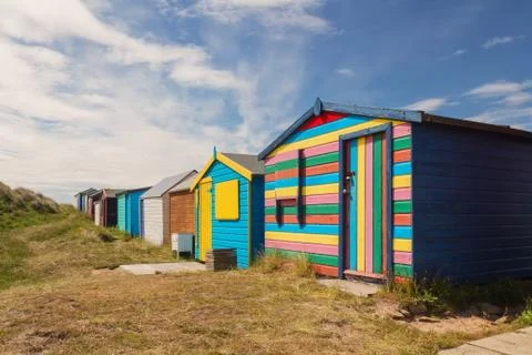 Bathing boxes in a beach Stock Photos