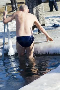 Bathing in an ice-hole Stock Photos