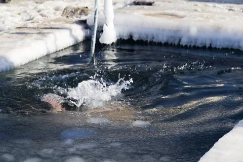 Bathing in an ice-hole Stock Photos