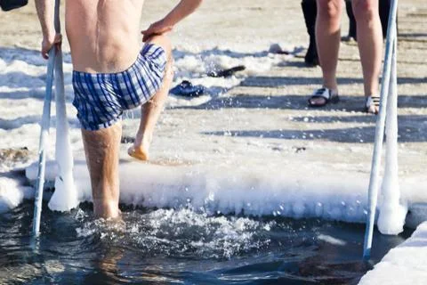 Bathing in an ice-hole Stock Photos