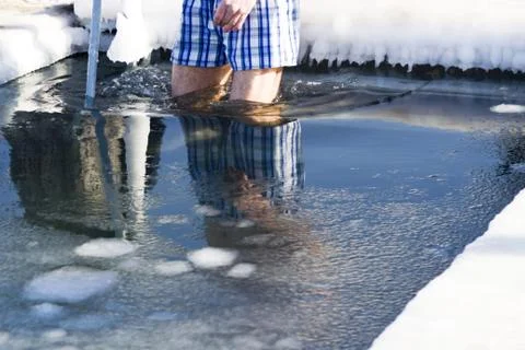 Bathing in an ice-hole Stock Photos