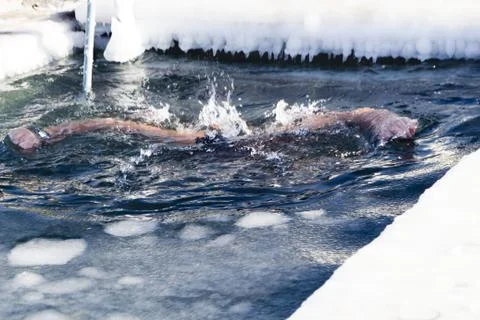 Bathing in an ice-hole Stock Photos