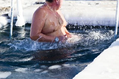 Bathing in an ice-hole Stock Photos