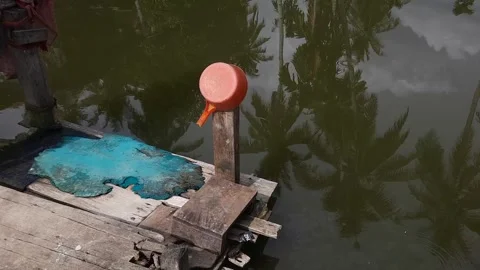 Bathing Pool with Plank Floor and Plastic Scoop in Outdoor Bathroom Stock-Footage 280169714