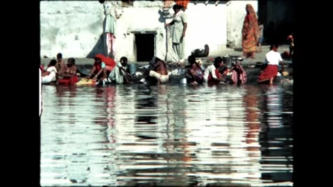 Bathing Ritual by the Temple Stock Footage 277976314
