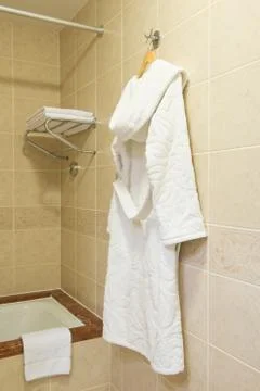 Bathrobe in the bathroom Stock Photos