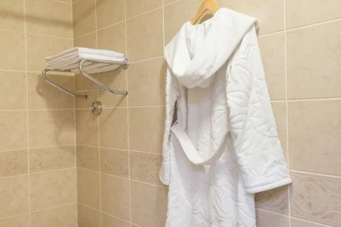 Bathrobe in the bathroom Stock Photos