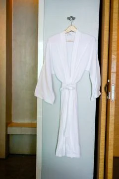 Bathrobe in the hotel bathroom Stock Photos